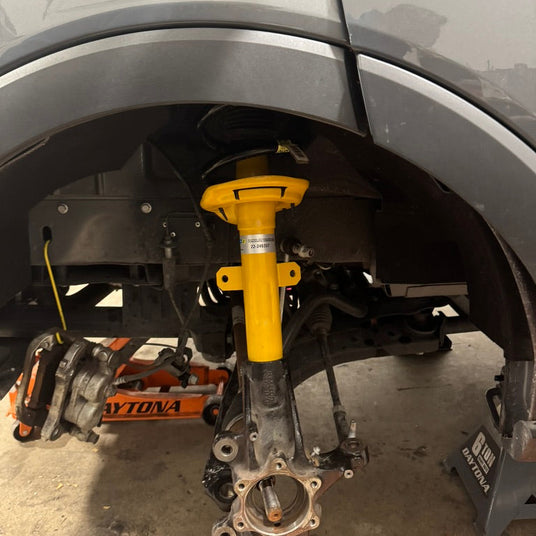 ford transit bilstein strut during wolf pack overland suspension install in washington