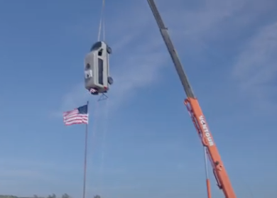 ca tuned bumper on sprinter hanging by a crane - a high quality bumper installed by wolf pack overland