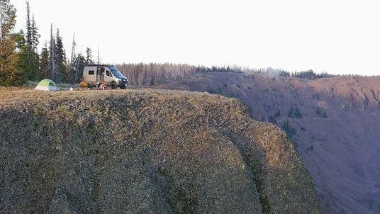 winnebageo revel with air locker and suspension installed by wolf pack overland parked over a mountain clif