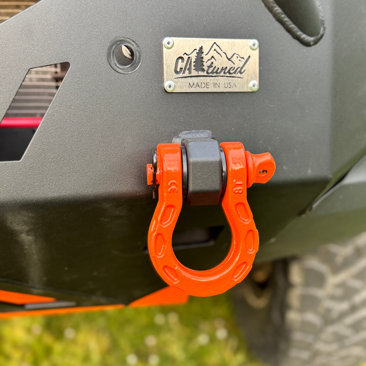 CAtuned MadMax Shackle D-Rings on bumper in orange