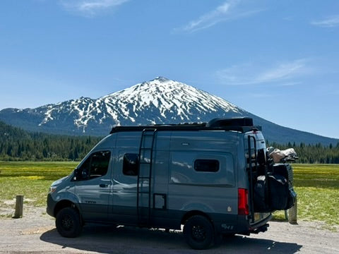 tiffin gh1 with suspension and storage upgrades at the base of a volcanic mountain in washington near wolf pack overland