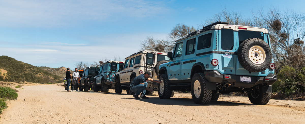 Ineos Grenadiers lined up on a dirt road