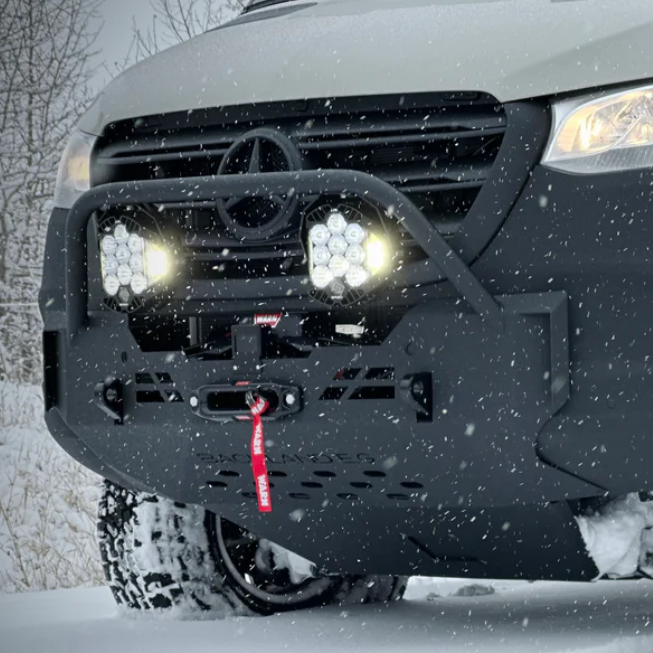 Warn VR EVO 12-S winch synthetic rope pulling through snow-covered Cascade Mountains terrain