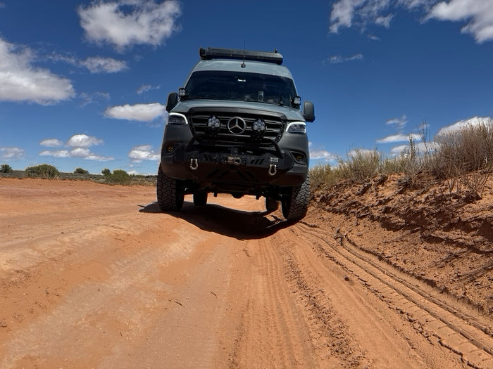 sprinter van off road in moab with agile rip kit suspension on a dirt trail